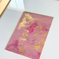 Detail of Rosy Outlook No. 01 — gold leaf, rose pink, and pencil lines on textured handmade paper